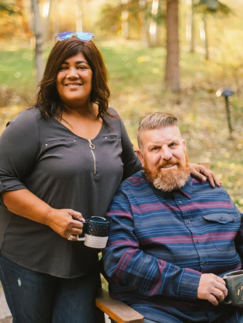 couple posing and smiling.