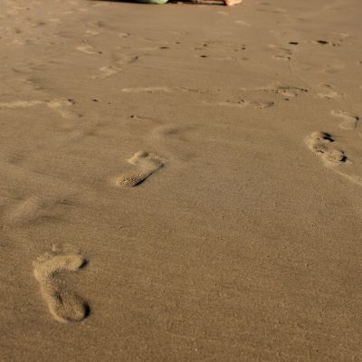 sandy footprints on a beach
