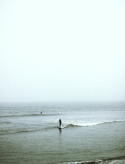 woman surfing on the ocean wave