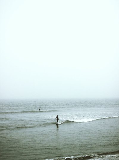 woman surfing on the ocean wave