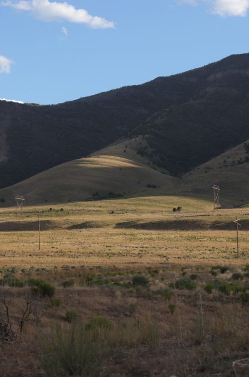 mountains with blue sky and grassy field